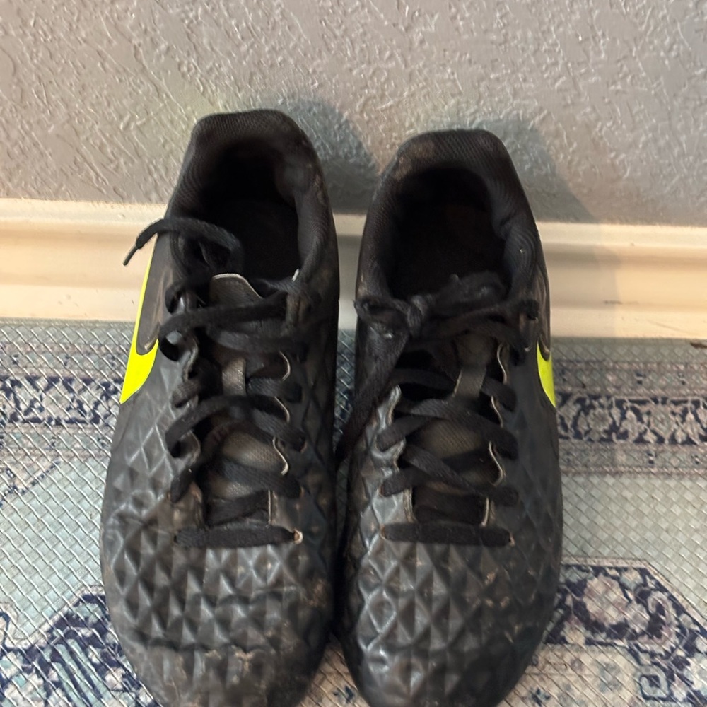 Nike Black Soccer Cleats with Neon Yellow Swoosh Accent